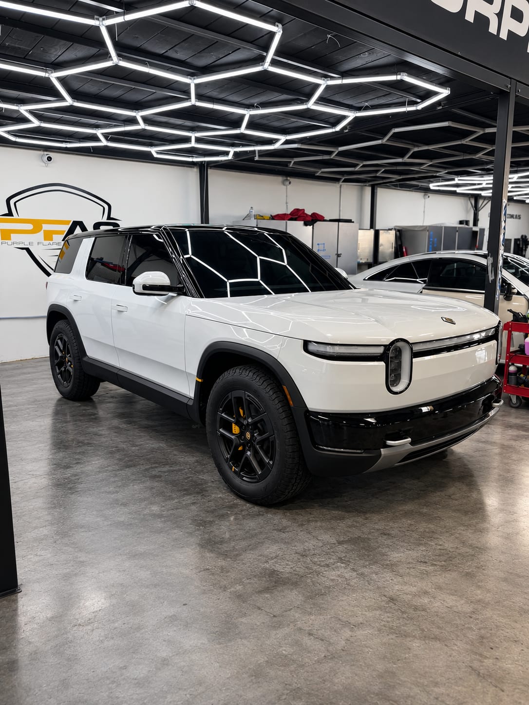 White Rivian R2 with ceramic window tint in our Henderson shop