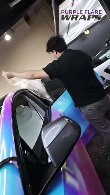 Window tint film being fitted to a car window in our Henderson shop